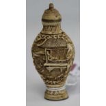 A Chinese reproduction carved faux ivory snuff bottle