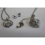 A Swarovski crystal set ring, two modern silver pendants and a pair of ear studs (4)