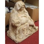 A 19th century carved limestone pieta, in Northern European Gothic style, with integral wrought iron