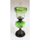 An early 20th century green tinted glass oil, lamp, with acid etched glass shade, 56cm high