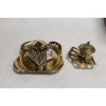 An early 20th century brass inkwell, having egg and dart decoration, w.13cm; together with one other