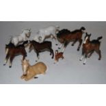 A Beswick foal model No. A15 dapple grey gloss finish together with various other Beswick foals