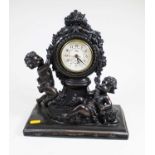 A bronzed figural mantel clock, in the form of two putti, height 32cm