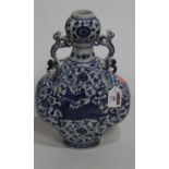 A Chinese export double gourd moon vase, having blue and white decoration depicting a dragon, h.