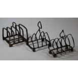 A late Victorian silver four-division toast rack, maker James Dixon & Sons, Sheffield 1893; together