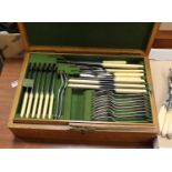 An early 20th century oak cased canteen of silver plated cutlery (12 place setting, incomplete)