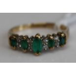 A contemporary 9ct gold emerald and diamond point set half hoop ring, 2.4g, size P/Q