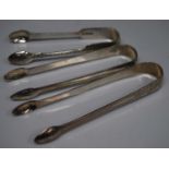 A pair of William IV silver sugar tongs, George Burrows, London, 1834, together with two other pairs
