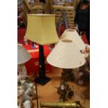 A pair of Italian style carved gilt table lamps, H55cm, together with another contemporary lamp (3)