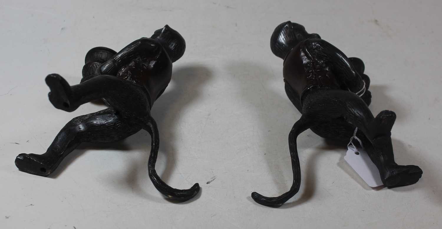 A pair of modern bronze figural candlesticks, each in the form of a monkey holding a sconce, h.16cm - Image 3 of 3