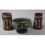 Two Wedgwood brown jasperware jugs, together with a green jasperware pedestal bowl, 22cm dia. (3)