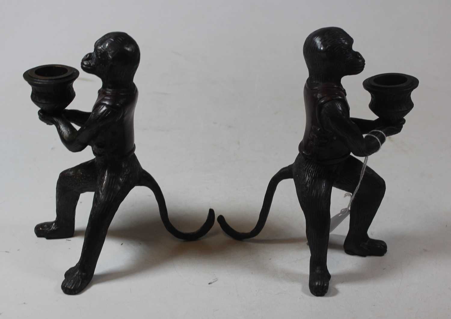 A pair of modern bronze figural candlesticks, each in the form of a monkey holding a sconce, h.16cm - Image 2 of 3