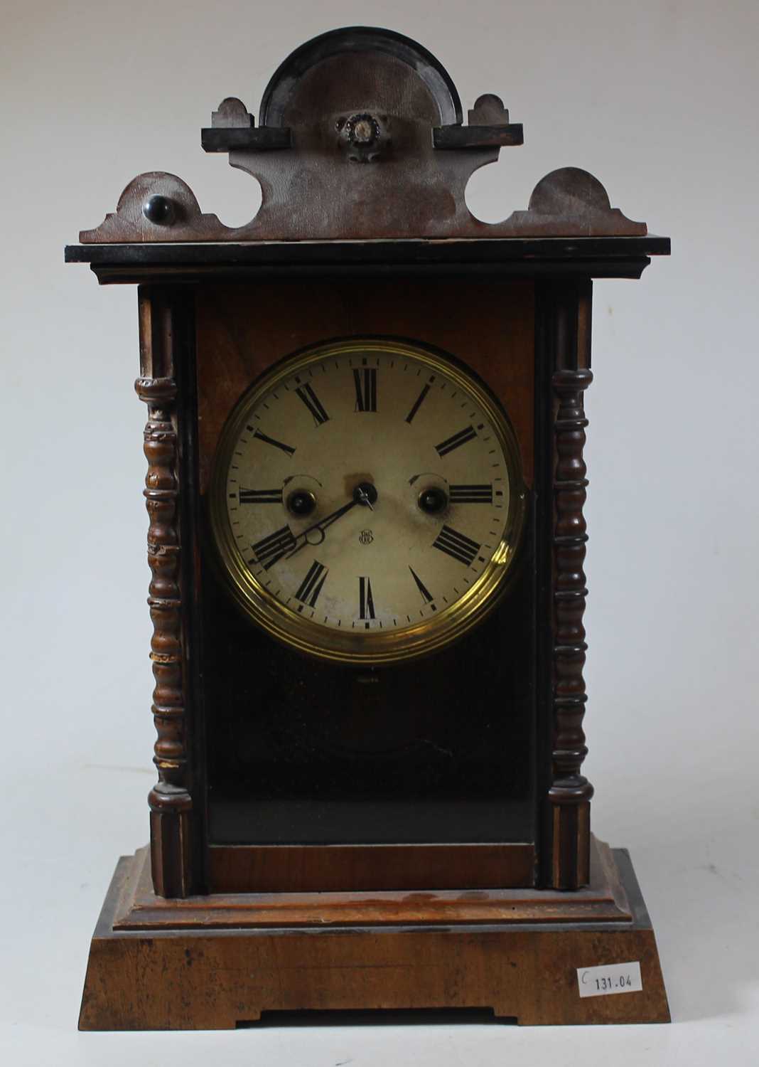 An early 20th century walnut cased 8 day mantel clock, 41cm high