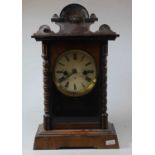 An early 20th century walnut cased 8 day mantel clock, 41cm high