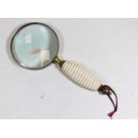 A 19th century style brass and ivorine magnifying glass, 24cm