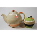 A Susie Cooper Crown Burslem Works teapot cover, together with a similar preserve pot and cover (2)