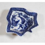 An 18th century English blue and white porcelain pickle dish, decorated with figures before a