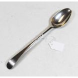 An 18th century silver serving spoon