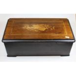 A late 19th century faux rosewood cased Swiss music box, having a 9" cylinder playing eight