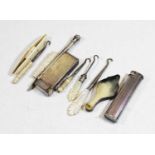 A collection of miscellaneous items, to include pocket cigarette lighters, ivory handled button