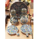 An Iznik style pottery charger, dia.34cm; together with a pair of similar vases and a pair of