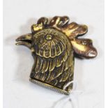 A novelty brass vesta in the form of a roosters head, the underside of the beak with press catch