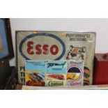 Four various reproduction tin and enamel racing and petrol related signs to include an Esso 'Put a