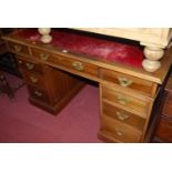 A Georgian style mahogany pedestal desk, with red leather inset writing surface, w.141cm
