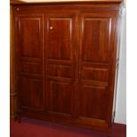 A contemporary joined cherrywood three door wardrobe, w.168cm