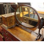 A walnut cased sewing machine, together with a mahogany swing framed toilet mirror (2)
