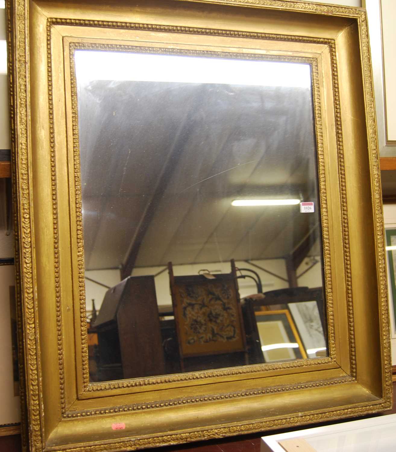 A circa 1900 gilt composition picture frame with later inset mirrorplate, 90 x 78cm