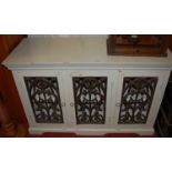 A contemporary painted hardwood three door side cabinet, width 133cm, together with a painted