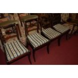 A set of four 19th century rosewood and brass inlaid rope twist dining chairs raised on sabre