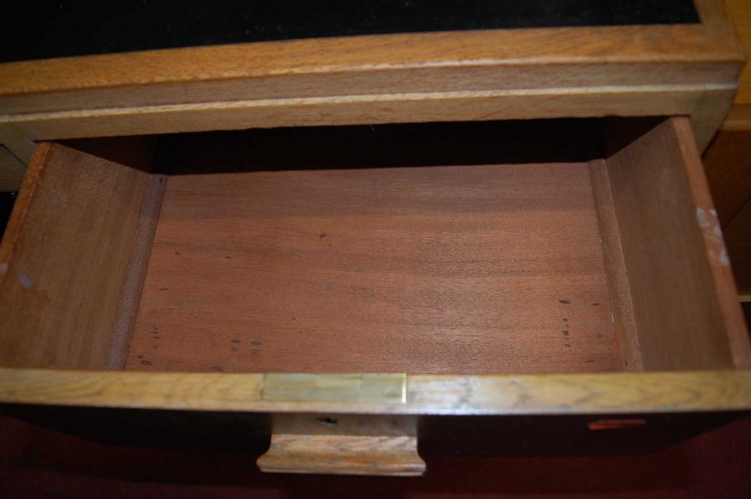 An Art Deco limed oak single pedestal writing desk, having black rexine inset surface, w.101cm; - Image 8 of 8