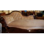 A Victorian mahogany framed scroll end chaise-longue, having buttoned upholstery, approx length