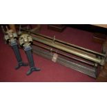 Two circa 1900 brass and iron fire fenders; together with a pair of brass and cast iron fire dogs;