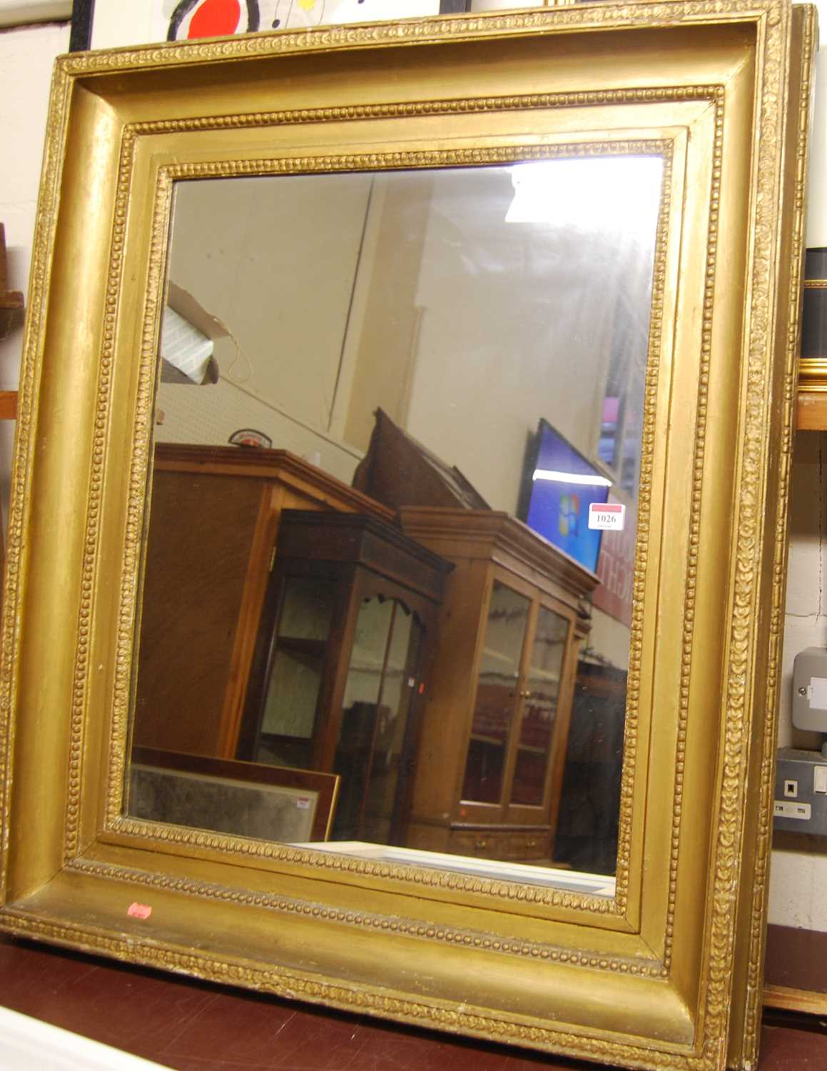 A circa 1900 gilt composition picture frame with later inset mirrorplate, 90 x 78cm - Image 2 of 2