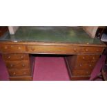 A Victorian oak pedestal desk, with green leather inset writing surface, width 135cm