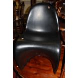 After Verner Panton - a single black polypropylene stacking S-chair