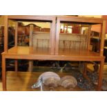 A large 20th century teak coffee table 138 x 77cm, together with a smaller matching pair of coffee