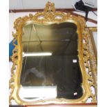 A reproduction gilt composition framed and bevelled wall mirror, 116 x 74cm