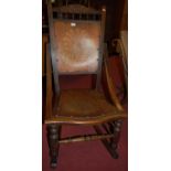 An Edwardian walnut panelled back and seat rocking chair
