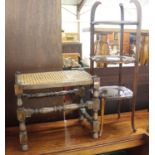 An early 20th century carved walnut three-tier cake stand, 81cm high, together with a caned foot