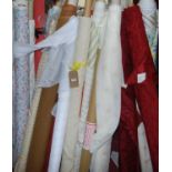 A collection of various sundry rolls of fabric