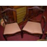 A set of six mahogany Hepplewhite style dining chairs, having red upholstered floral drop-in pad