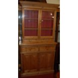 A Swedish pine dresser, with twin glazed upper doors, width 107cm