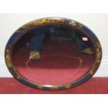 A 1920s blue lacquered and chinoiserie decorated wall mirror of oval form, width 56cmCondition