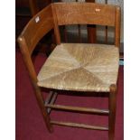 A 1930s oak framed tan leather and further studded low armchair, together with a 19th century oak