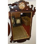 A 19th century mahogany fret carved mirror with gilt decoration, 93 x 53cm