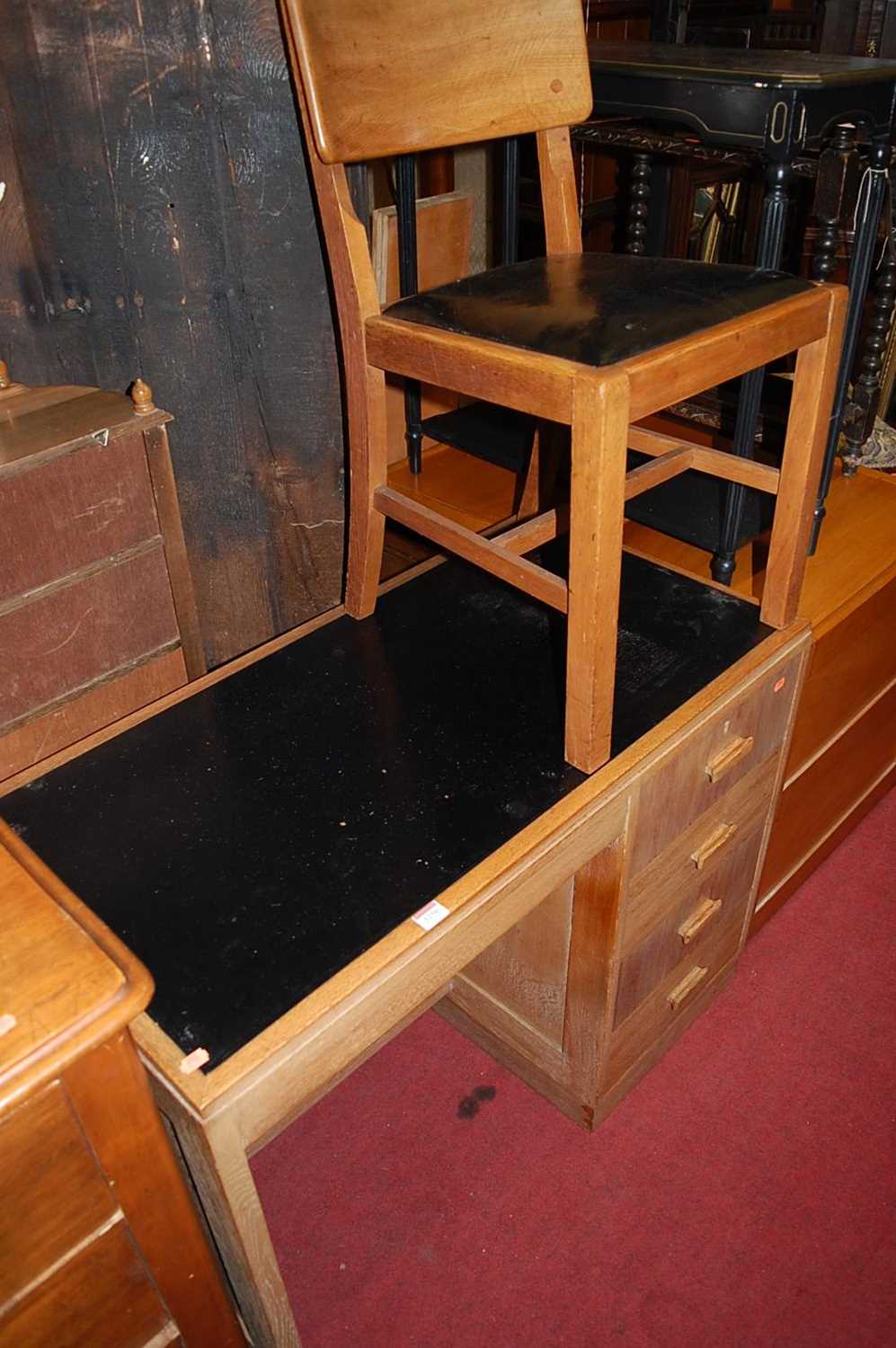 An Art Deco limed oak single pedestal writing desk, having black rexine inset surface, w.101cm;